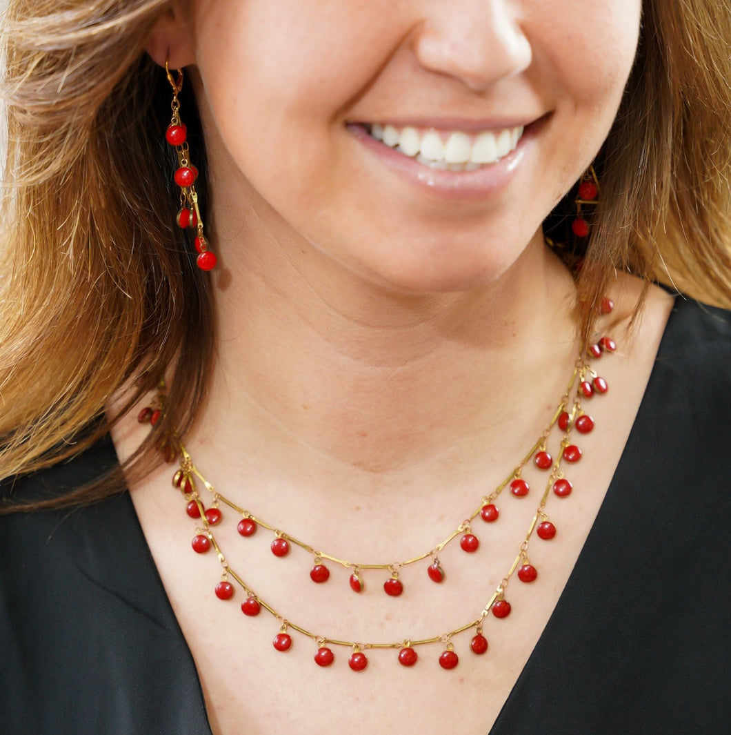 Red enamel necklace on gold